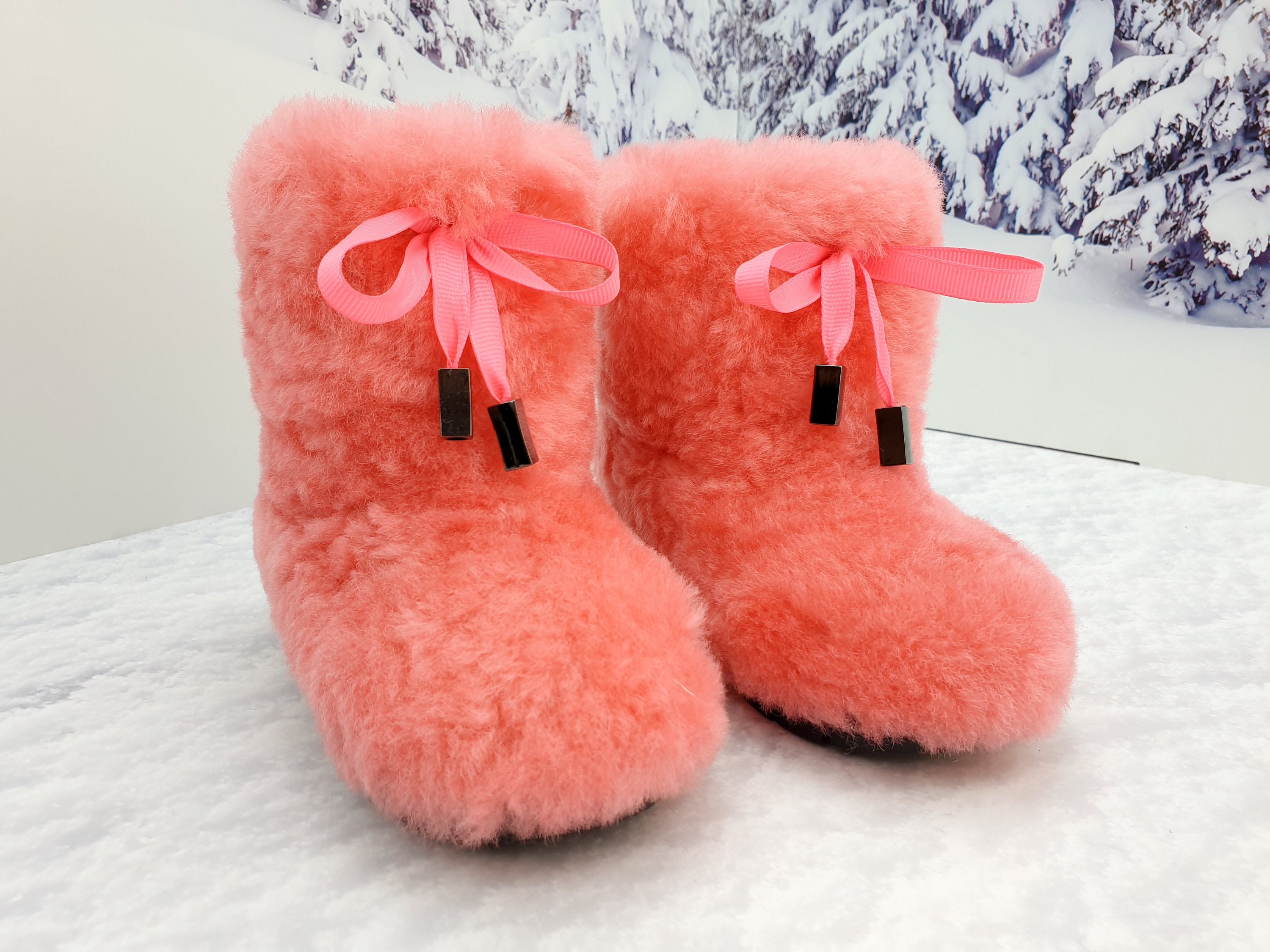 Pink mukluk sweater boots discount