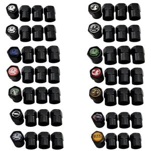 May include: Set of 12 black tyre valve stem caps with various Vauxhall logos, including the Vauxhall Griffin, Astra, and GTC.