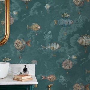 May include: Teal wallpaper featuring whimsical illustrations of fish-shaped hot air balloons, clouds, and sea creatures. The design includes various colors like teal, gold, and coral, creating a unique and imaginative aesthetic. This wallpaper is ideal for adding a touch of fantasy to any room.