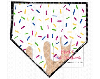 May include: A white baseball home plate with a brown and white ice cream cone dripping down the side. The home plate is covered in colorful sprinkles.