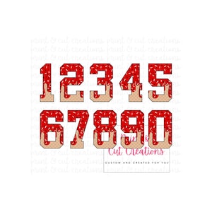 May include: Red and white numbers 1 through 5 and 6 through 0 with a red and white sprinkle pattern and a red drip effect. The numbers are in a bold, blocky font.