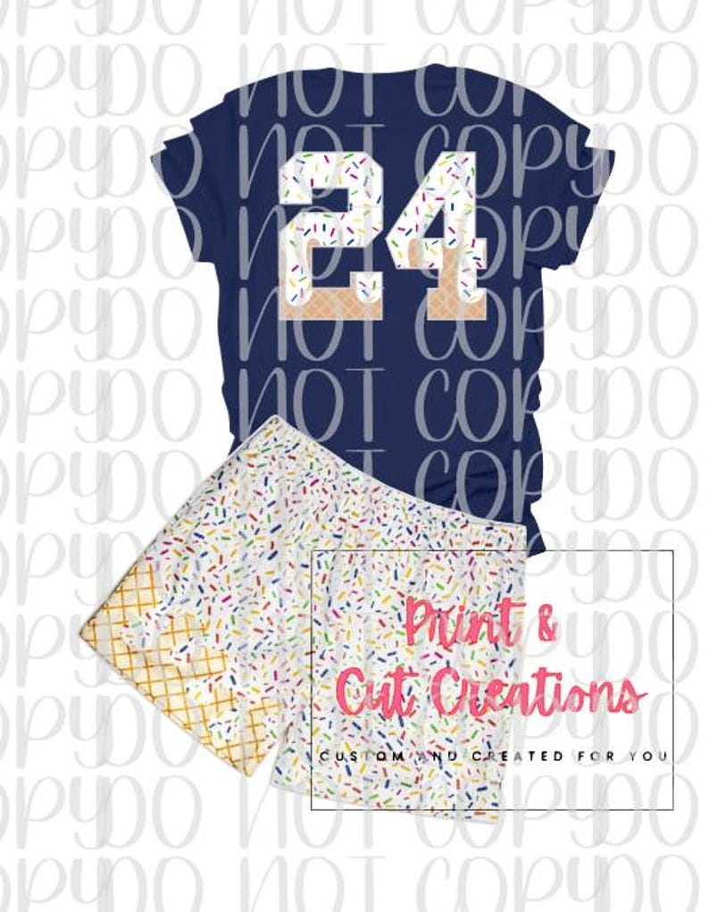 May include: Navy blue t-shirt and shorts set. The t-shirt features the number 24 in a design with sprinkles and waffle cone accents. The shorts have a white background with colorful sprinkles and waffle cone edges. The text "Print & Cut Creations" is visible.