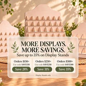 May include: Three light-colored wooden tiered display stands with multiple slots for organizing items. A translucent overlay features the text: MORE DISPLAYS. MORE SAVINGS. Save up to 35% on Display Stands. Orders $150+ Use code SAVE150 Save 28%.