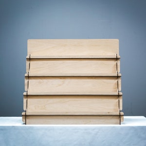 Collapsible display riser, ideal for craft fair displays and organizing products on a table top