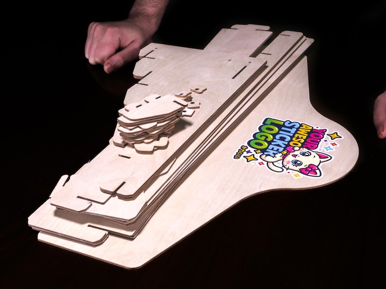 Countertop wooden sticker display stand shown packed flat with header panel.