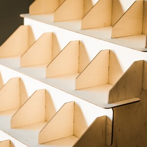 Wooden soap display stand with multiple tiers, perfect for use as a soap holder and shower organizer