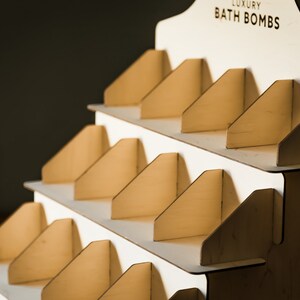 Elegant soap display stand with multiple tiers, perfect for showcasing soaps in a bathroom decor