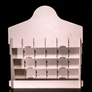 Rear view showing slotted shelves and dividers inside the birch frame.