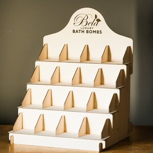 Multi-tier wooden craft fair display stand, ideal for organizing and displaying cards at market stalls