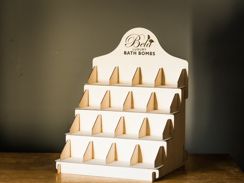 Wooden soap display stand with dividers, perfect for organizing soap in a bathroom decor setup