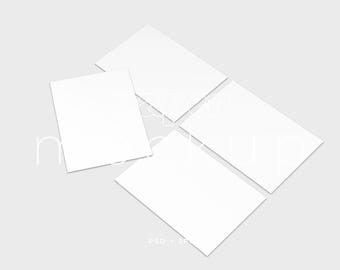 May include: Four white rectangular cards arranged on a light gray surface. The cards are slightly angled, with one card positioned closer to the viewer. The words "mockup" are faintly visible in the background.