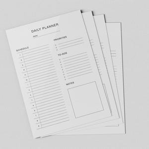 May include: A stack of white daily planner sheets with a minimalist design. Each sheet features sections for schedule, priorities, to-dos, and notes. The text "DAILY PLANNER" is at the top, with lines for date. The sheets are on a light gray background.