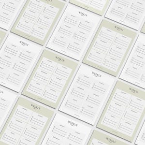 May include: A collection of weekly planner sheets with a minimalist design. Each sheet features a layout for daily scheduling, with the word "WEEKLY" at the top. The sheets are in shades of white and light green.