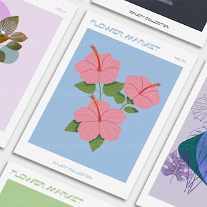 May include: A collection of art prints featuring floral and botanical illustrations. One print showcases pink hibiscus flowers on a light blue background. Other prints display abstract plant designs in various colors, including green, purple, and orange.