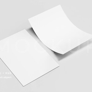 May include: A mockup image featuring two white rectangular papers, one flat and the other slightly curved, against a light gray background. The word "MOCKUP" is faintly visible. Text at the bottom reads "JPG + PSD smart object."