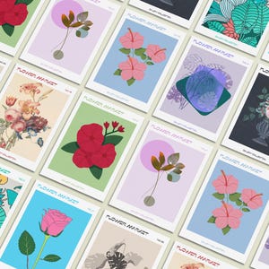 May include: A collection of art prints featuring floral illustrations. Each print showcases a different flower arrangement or botanical design, with a variety of colors and styles. The prints are labeled "Flower Market" and are displayed on a white background.