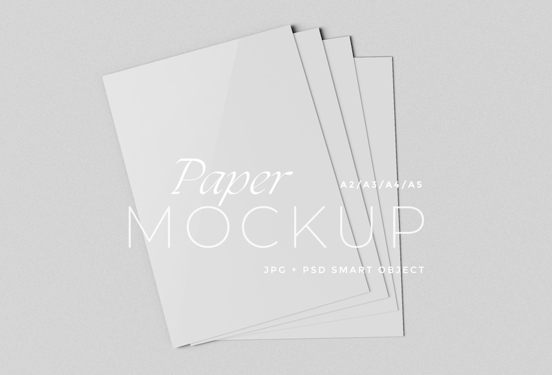 May include: A stack of white paper mockups, with the text "Paper MOCKUP" and "A2/A3/A4/A5" in a minimalist design. The image also includes the text "JPG + PSD SMART OBJECT". The papers are arranged in a fan shape.