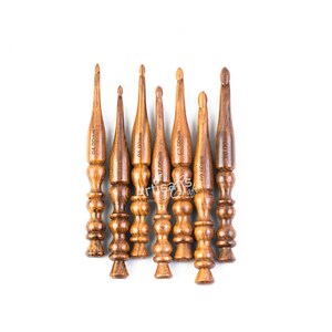 May include: Set of eight wooden crochet hooks in various sizes, ranging from 4.00mm to 10.00mm. The hooks are brown and have a smooth, polished finish.