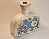 Ceramic vase is burned using the Raku technique. Dried flower vase. Vase with colored circles. Raku Pottery. Raku vase.