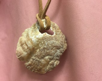 Northern California textured shell pendant on rawhide necklace