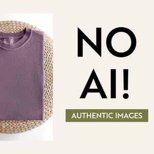 May include: A mauve-colored crew neck t-shirt rests on a woven surface. The image features the text "NO AI!" in bold black letters, with "AUTHENTIC IMAGES" in a green rectangle below, emphasizing the product's authenticity.