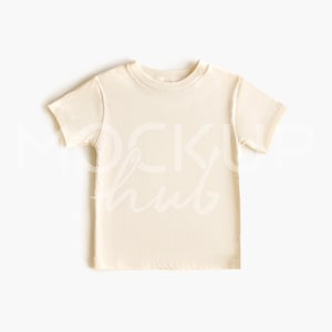 May include: A short-sleeved, cream-coloured t-shirt. The shirt has a crew neck and is made of a soft, lightweight material. The shirt is a blank canvas, perfect for customisation or simple wear.