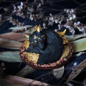 Miniature oinari black nine tailed fox figurine sleep in woods. Handmade resin fox art. Sleeping Katsune figure. Fox sculpture statue totem.