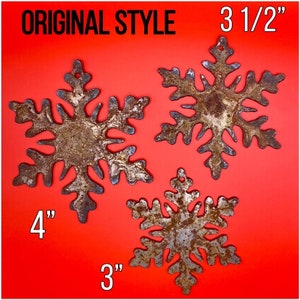 May include: Three rustic metal snowflakes in varying sizes, with a distressed, aged appearance. The largest snowflake measures 4 inches, the medium one is 3.5 inches, and the smallest is 3 inches. The text "ORIGINAL STYLE" is at the top.