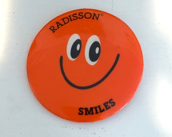 Vintage Radisson Smiles Button: Orange Smiley Face Pinback