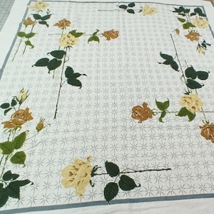 Vintage mid-century cotton table cloth floral with tan and cream roses. 47 x 49 inches no stains a little faded D