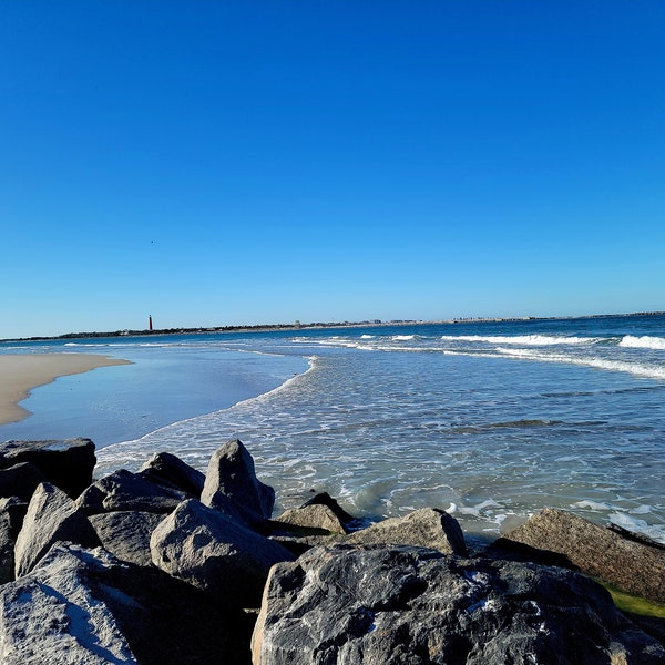 Beautiful clear blue sky January day on the shoreline of New Smyrna Beach,  Florida. New Smyrna Beach, Florida, ocean view, shoreline, beach