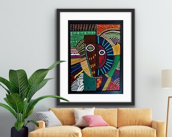 May include: Abstract art painting in a black frame with a colourful geometric design featuring a stylised face with a blue eye and a brown nose. The painting is hanging on a white wall above a tan sofa with cushions.