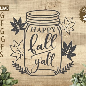 May include: A black and white illustration of a mason jar with the text "Happy Fall Y'all" inside. The jar is surrounded by leaves and vines.