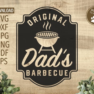 May include: Black and white sign with a vintage design. It says "Original Dad's Barbecue" with a grill graphic.