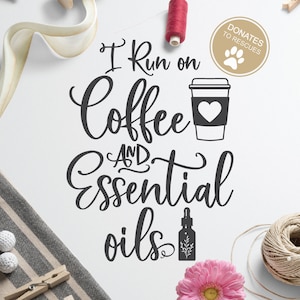 May include: Black and white text graphic that reads "I run on coffee and essential oils". The graphic includes a stylized image of a coffee cup with a heart and a bottle of essential oil.