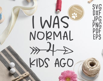 May include: White background with black text that reads "I WAS NORMAL 24 KIDS AGO" with a black arrow pointing to the right and left.  The text is in a handwritten font.  There are various craft supplies around the text, including a spool of thread, a pink flower, and a roll of twine.