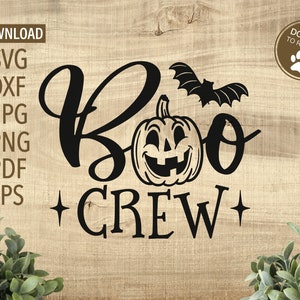 May include: Black and white graphic design with the text "Boo Crew" and a pumpkin with a smiling face. A bat is flying above the pumpkin.