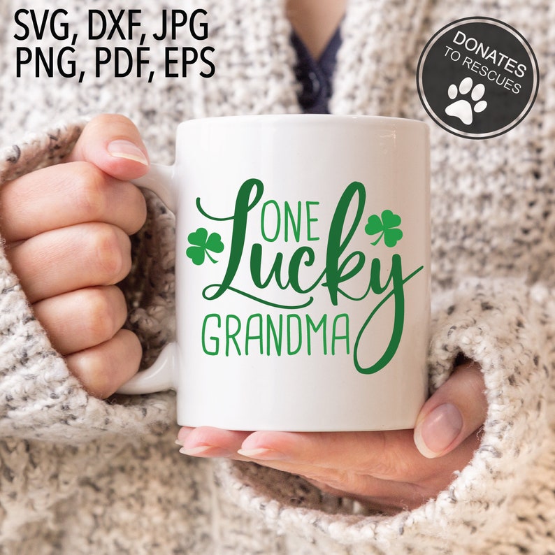 May include: White ceramic mug with a green shamrock and the text "One Lucky Grandma".