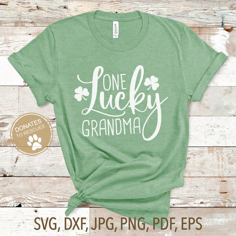 May include: Green t-shirt with the text "One Lucky Grandma" in white with a shamrock design.