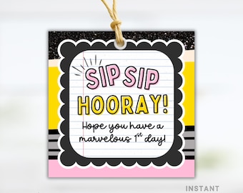 May include: A square gift tag with a black scalloped border and a glittery top. The tag features the words "SIP SIP HOORAY!" in pink and yellow, with the message "Hope you have a marvelous 1st day!" below. A string is attached.