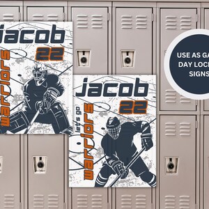 May include: Two white and orange hockey locker signs with a hockey player graphic. The signs say "Jacob" and "Warriors let's go" with the number "22".