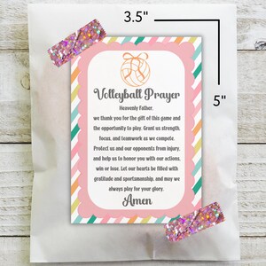 May include: A 3.5 x 5 inch card with a volleyball prayer printed on it. The card has a pink scalloped border and a colorful striped background. The text includes the word "Amen". The card is held in a white bag and secured with glitter tape.