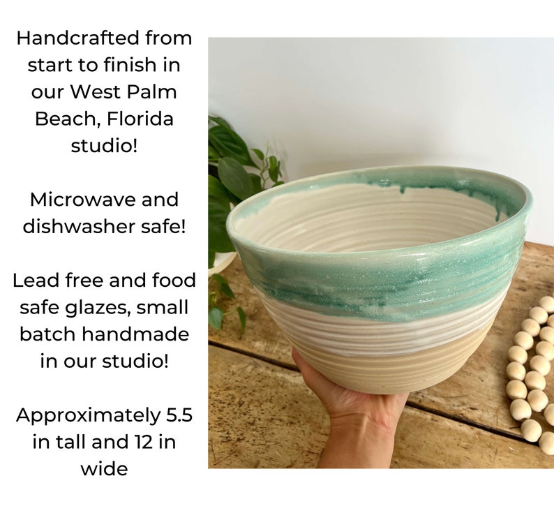 May include: A large, handmade ceramic bowl with a light green glaze and white stripes. The bowl is 5.5 inches tall and 12 inches wide. It is microwave and dishwasher safe.