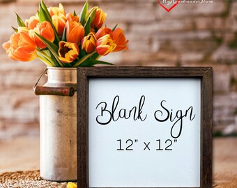 May include: A square, blank sign with a dark brown wooden frame, measuring 12 inches by 12 inches. The sign has the words "Blank Sign" in elegant script. A bouquet of orange tulips sits in a metal milk jug to the left.