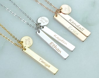 May include: Three gold, silver, and rose gold necklaces with personalized bar pendants and circular charms. The charms read "My Girls", "My Boys", and "My Kiddos". The bar pendants are engraved with the names "Tanya", "Ethan, Kayden", and "Erica, Kendall".