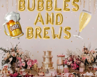 May include: Gold foil balloons spelling "Bubbles and Brews" with a beer mug and champagne flute balloon. A table with a pink tablecloth and floral arrangements is set up with a tiered cake stand and other decorations.