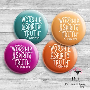 May include: Four round buttons in teal, orange, magenta, and coral, each with the text "WORSHIP WITH SPIRIT AND TRUTH" and "-JOHN 4:24" in white. The buttons are on a light wood grain surface.