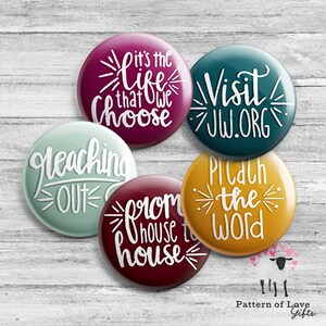 May include: Five round buttons with white text on different colored backgrounds. The buttons read "It's the life that we choose", "Visit JW.ORG", "Preaching out", "From house to house", and "Pitch the word".