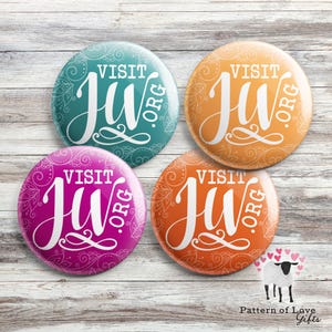 May include: Four round buttons with a white design on a teal, orange, pink, and orange background. The design features the text "VISIT JU.ORG" in a white cursive font.
