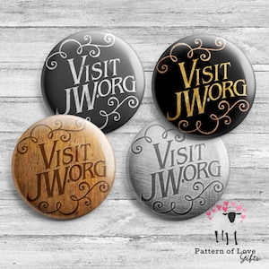 May include: Four round buttons with the text "Visit JW.ORG" in different styles. The buttons have a black, gold, wood, and gray background with white, gold, brown, and black text respectively. The buttons are decorated with a swirling vine design.